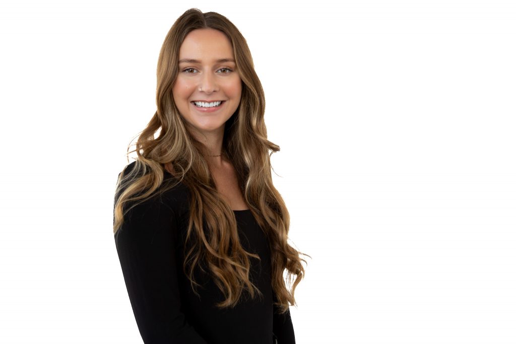 Professional mobile studio headshot of a woman on a white background for her Edmonton business.
